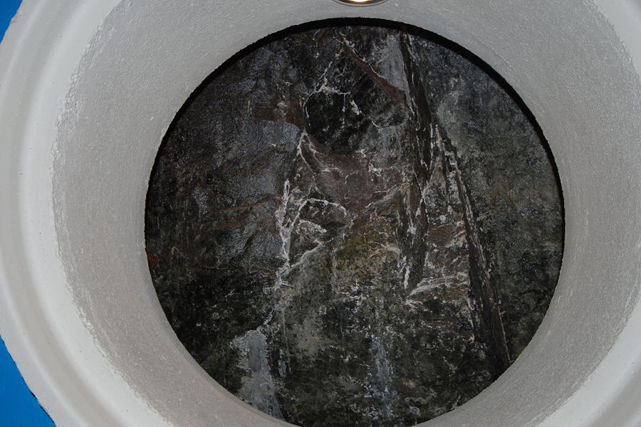 The décor and lighting elements contrast with bare rock face inside machine hall.